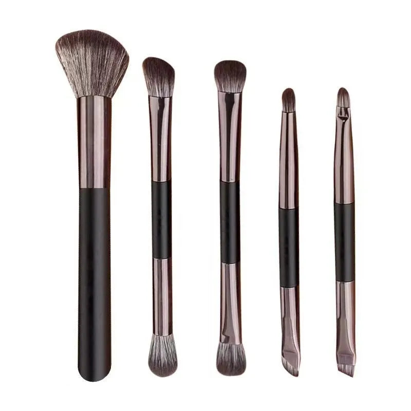 Boxed portable makeup brush set with mirror showing silver, gold, and little sparrow colour options