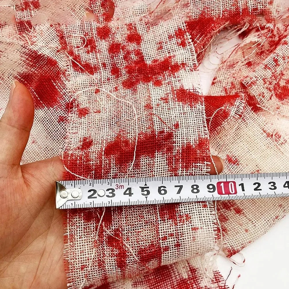 Roll of red dyed polyester gauze bandage for Halloween horror costumes and decorations.