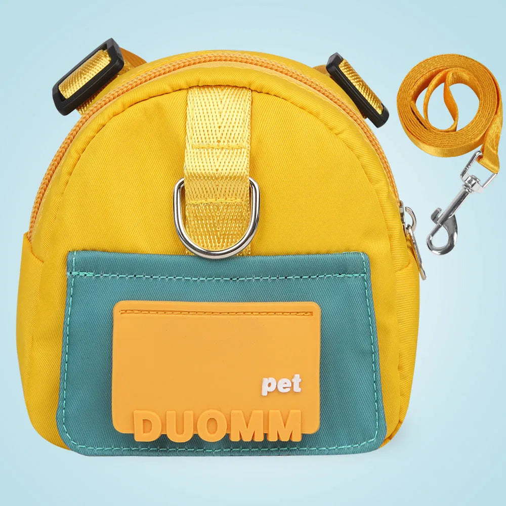 Blue adjustable dog backpack harness with storage compartments and a tow rope attached.