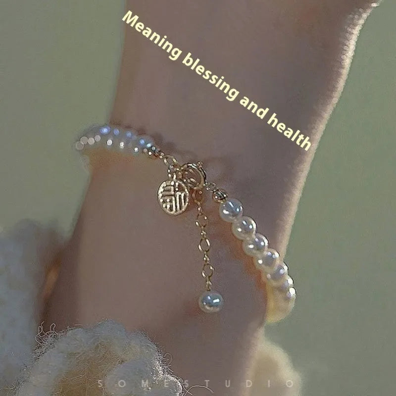 Chinese style handmade glass bead bracelet with bamboo joint elements on a white background.