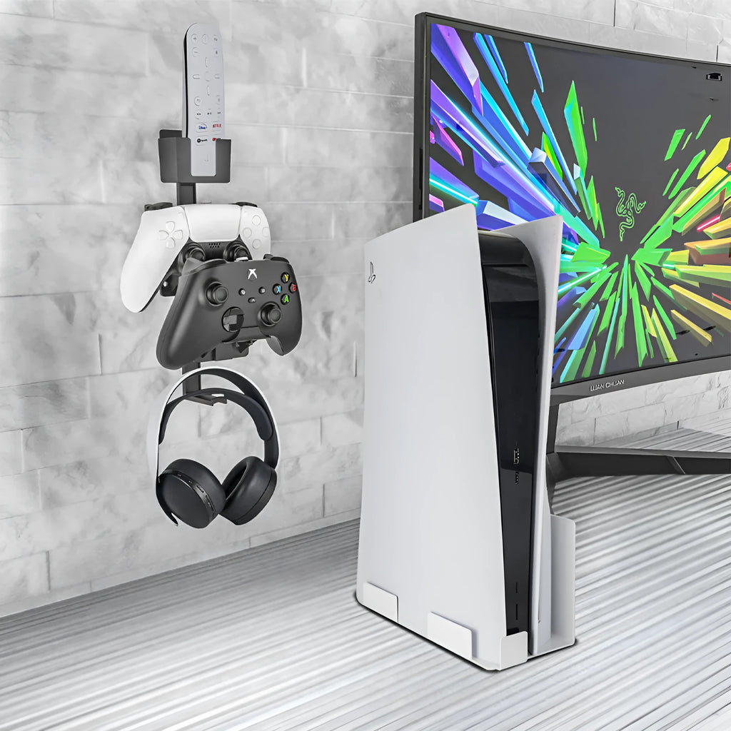 White wall-mounted hook holding PlayStation controller and headset