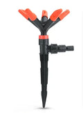 Orange plastic garden insert sprinkler with rotating water spray, 14 x 26.5cm, single nozzle
