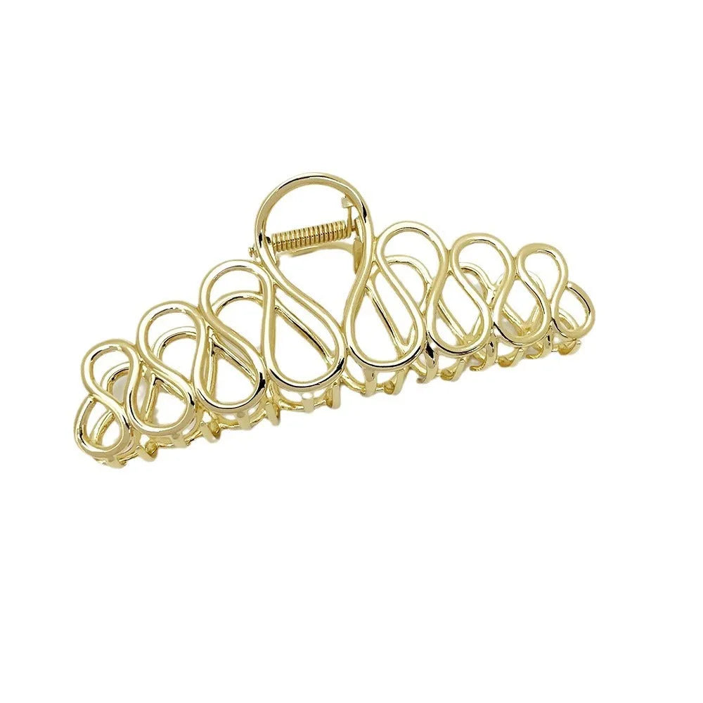 Large gold alloy hair clip with tassel decoration for updo hairstyles