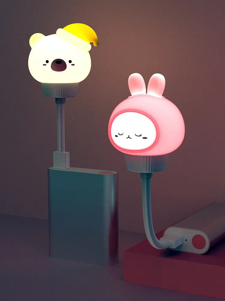 USB portable cartoon animal LED night light in rabbit design with adjustable brightness settings.