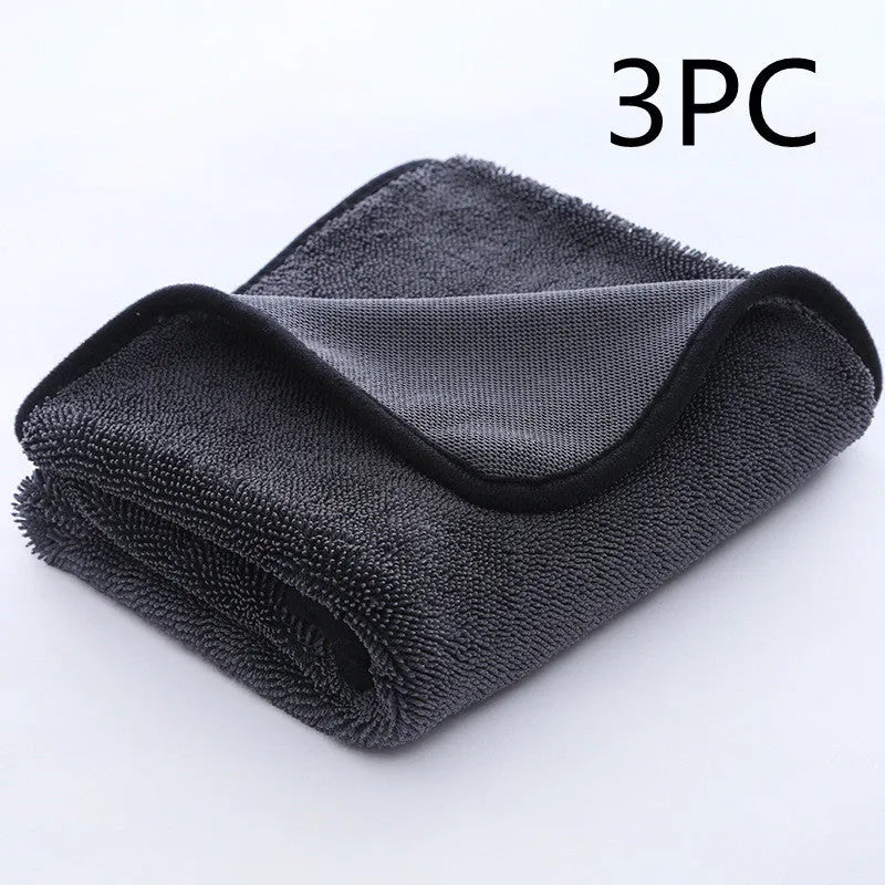 Grey car cleaning towel with black trim edge in various sizes from 20x30cm to 60x160cm.
