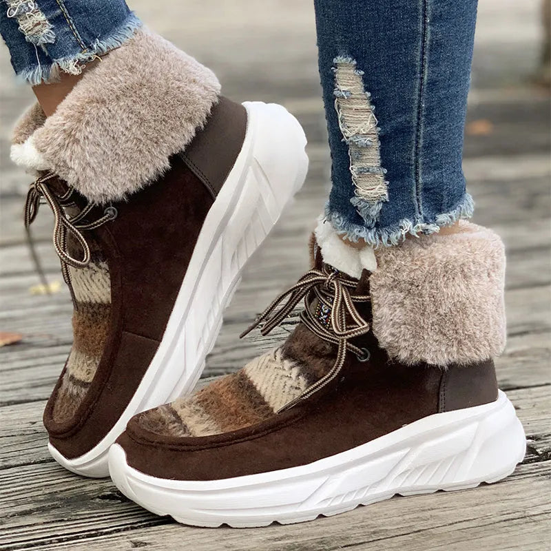 Beige women's lace-up suede snow boots with a thick sole and plush lining on a white background.