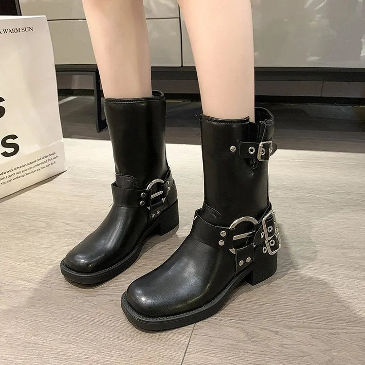 Women's black platform ankle boots with buckle detailing and mid-calf height