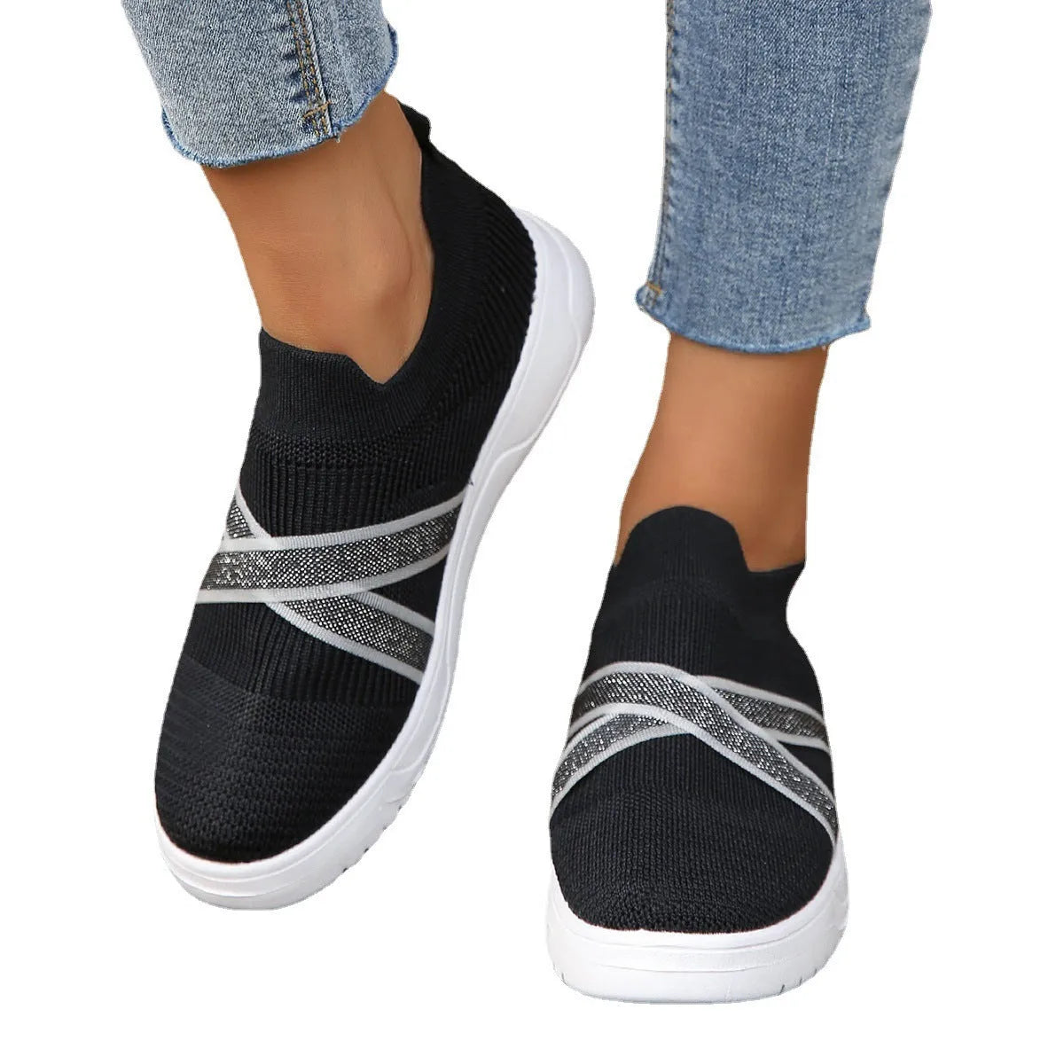 Women's black flat-bottom flyknit mesh shoes with round toe and tassel detail