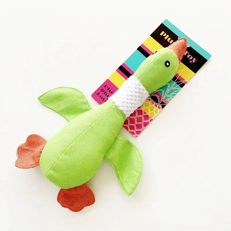 Blue, green or grey duck-shaped dog plush toy with squeakers, measuring 33 cm