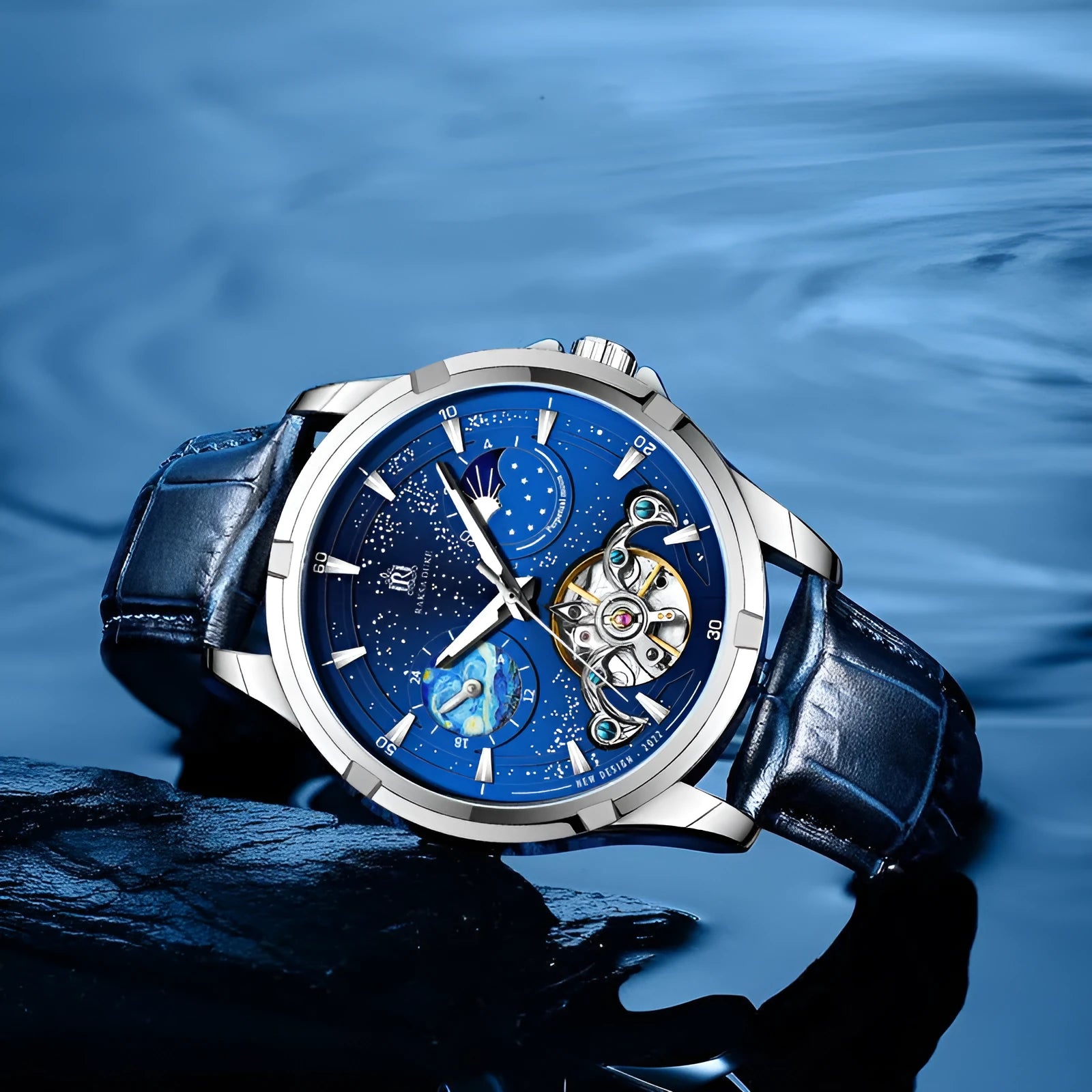 Men's blue automatic mechanical watch with stainless steel bracelet on wrist, showing T885B dial.