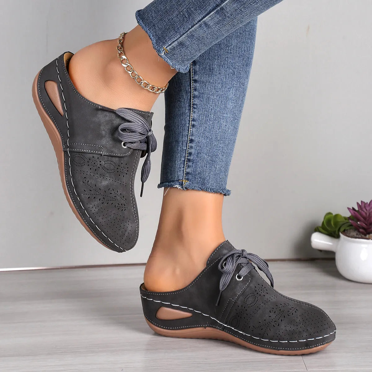 Women's summer baotou lace-up slippers with hollow-out wedge sole in a light grey colour.