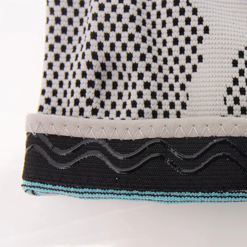 Sky blue elastic fibre knee pad for sports, shown in size L on a knee.