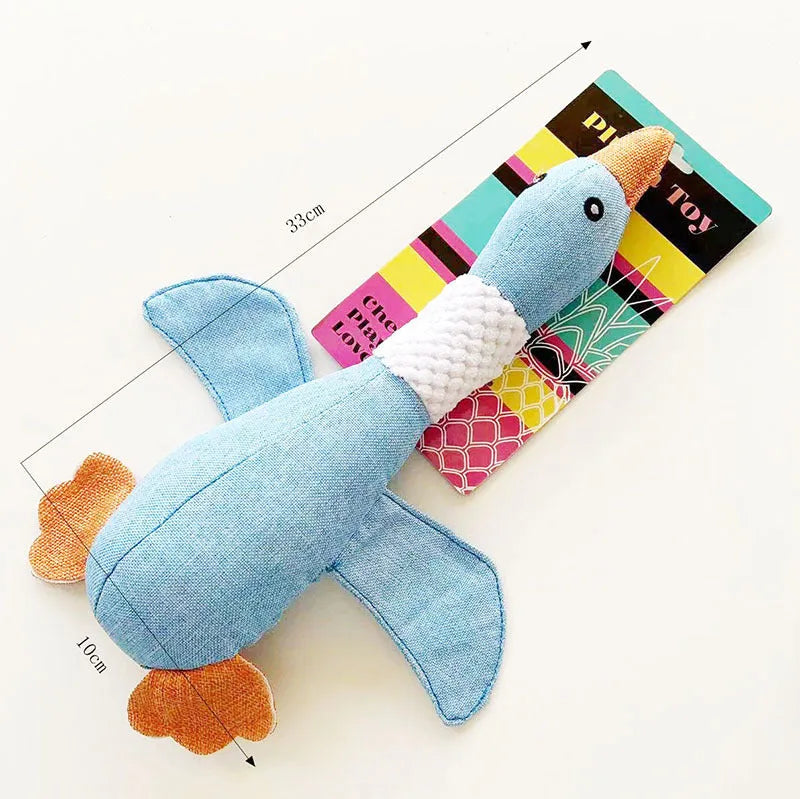 Blue, green or grey duck-shaped dog plush toy with squeakers, measuring 33 cm