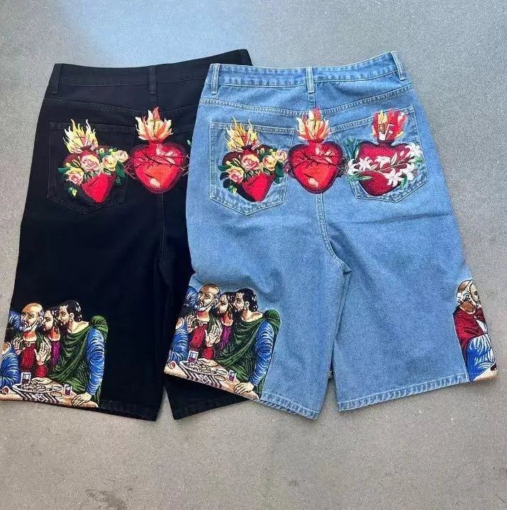 Men's blue cotton tapered shorts with Jesus print on back pocket, showing tapered leg design