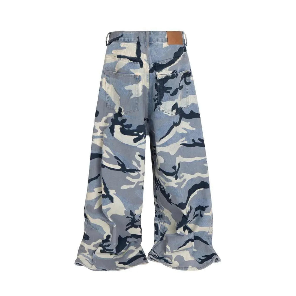 Snow camouflage blue loose-fit mid-waist jeans on a model, showing the camouflage pattern and trouser cut.