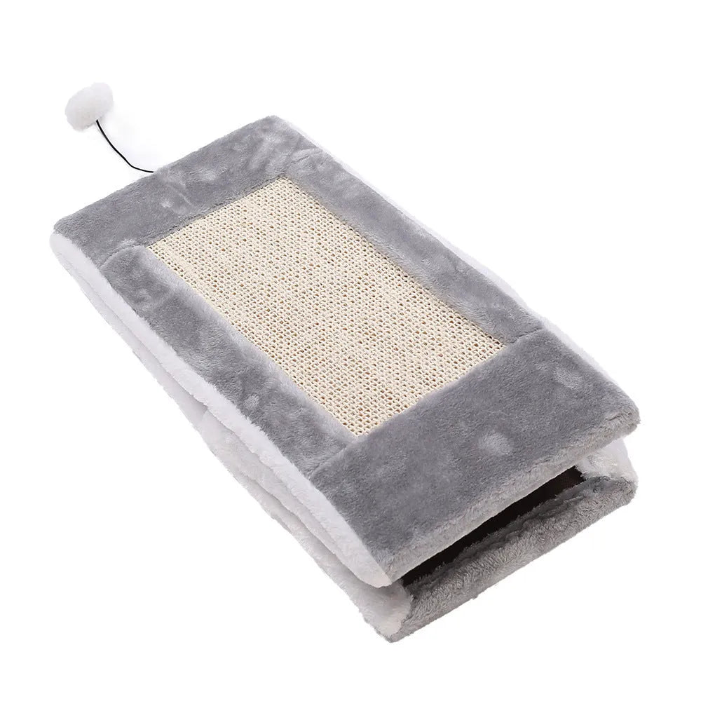 Grey and white triangle sisal scratching post for cats on a wooden floor.