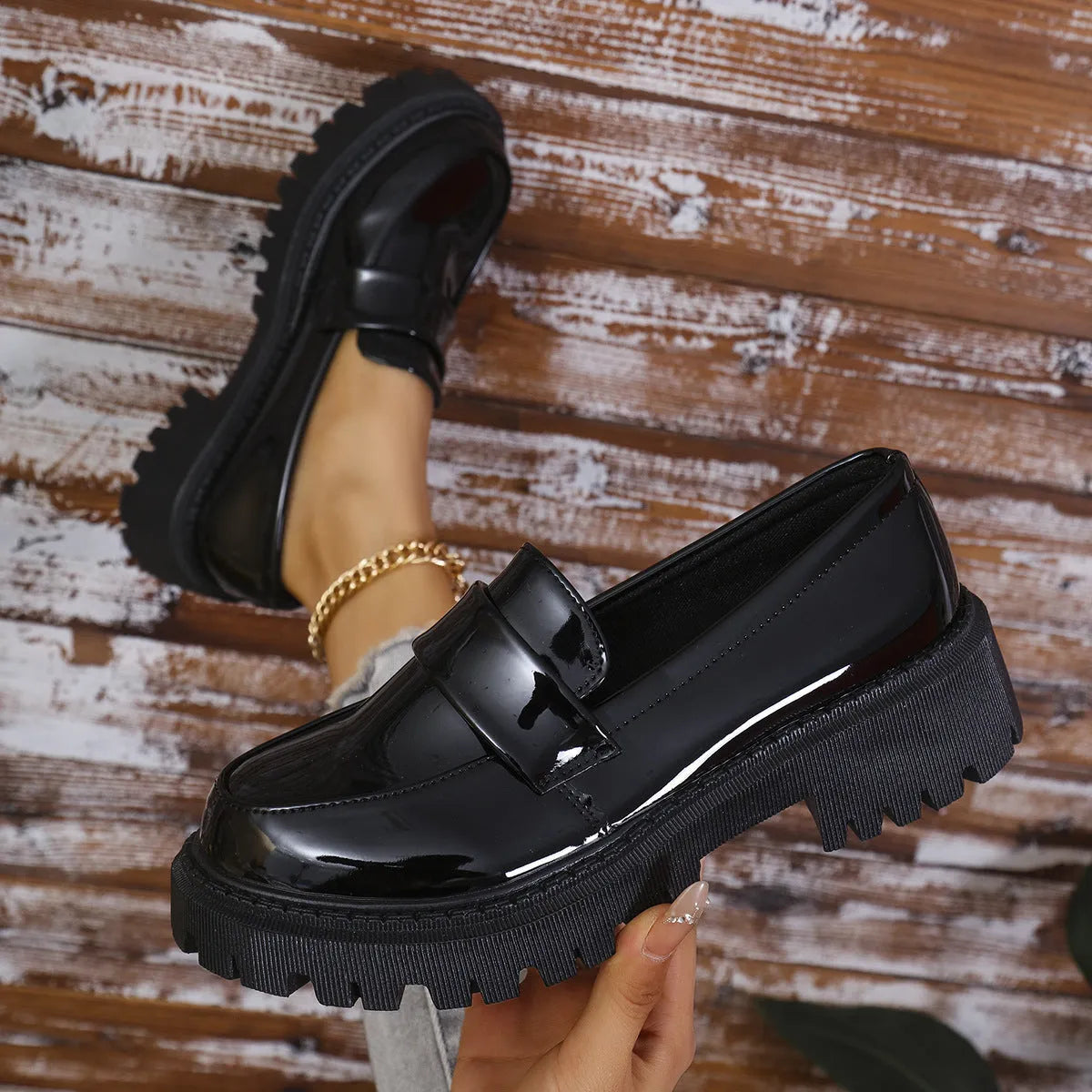 Women's black chunky heel slip-on loafers with a platform rubber sole.