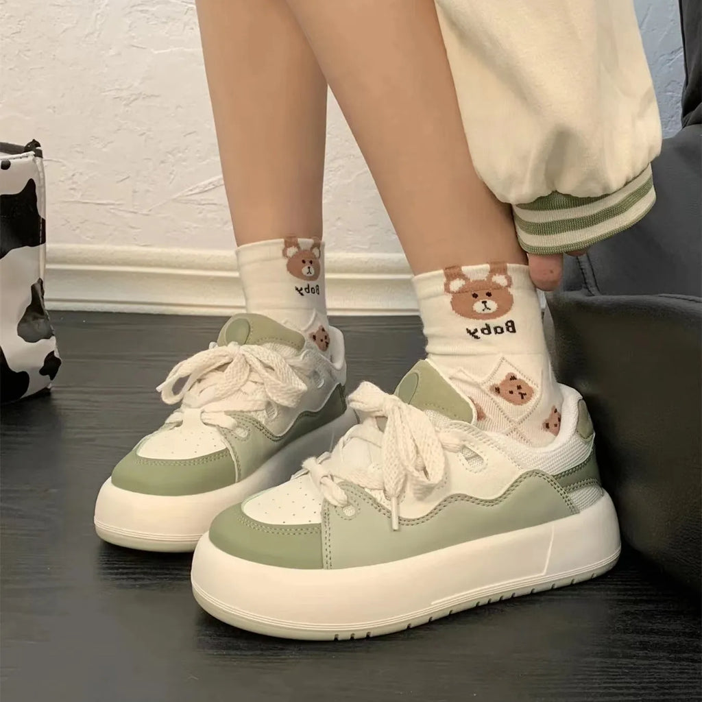 Green women's casual shoes with PU mesh upper, flat heel, and round toe.