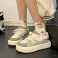 Green women's casual shoes with PU mesh upper, flat heel, and round toe.
