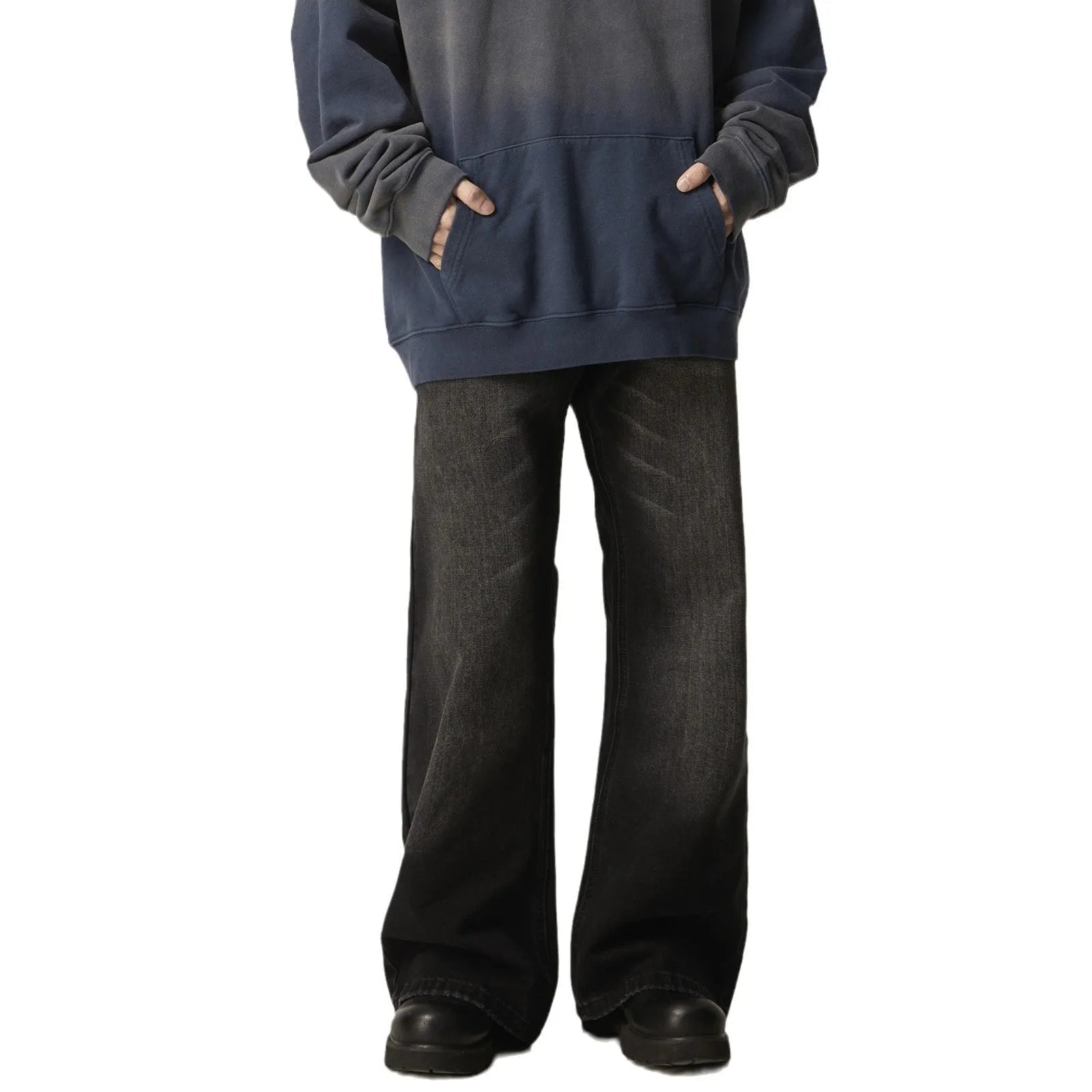 Black loose straight leg retro jeans on a hanger, showing zipper fly detail.