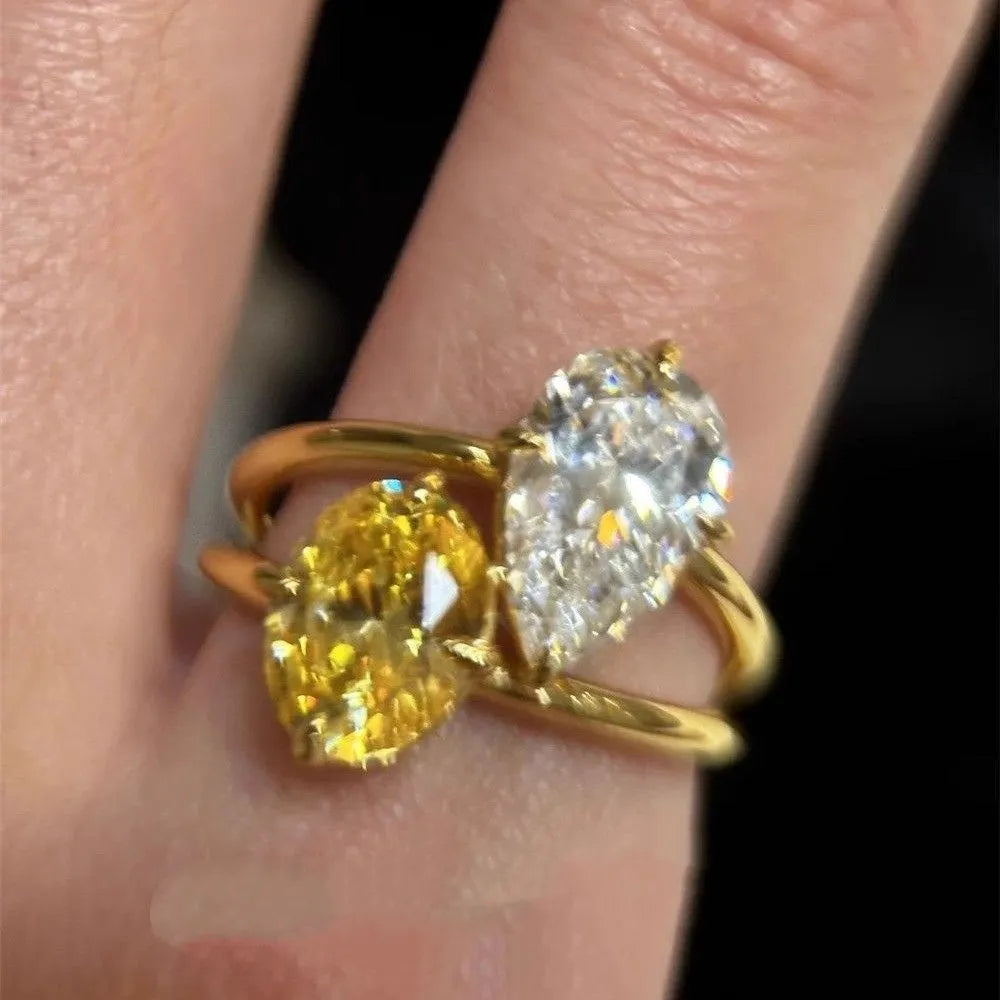 Water drop double Sheng stone copper ring with geometric open design and zircon detailing