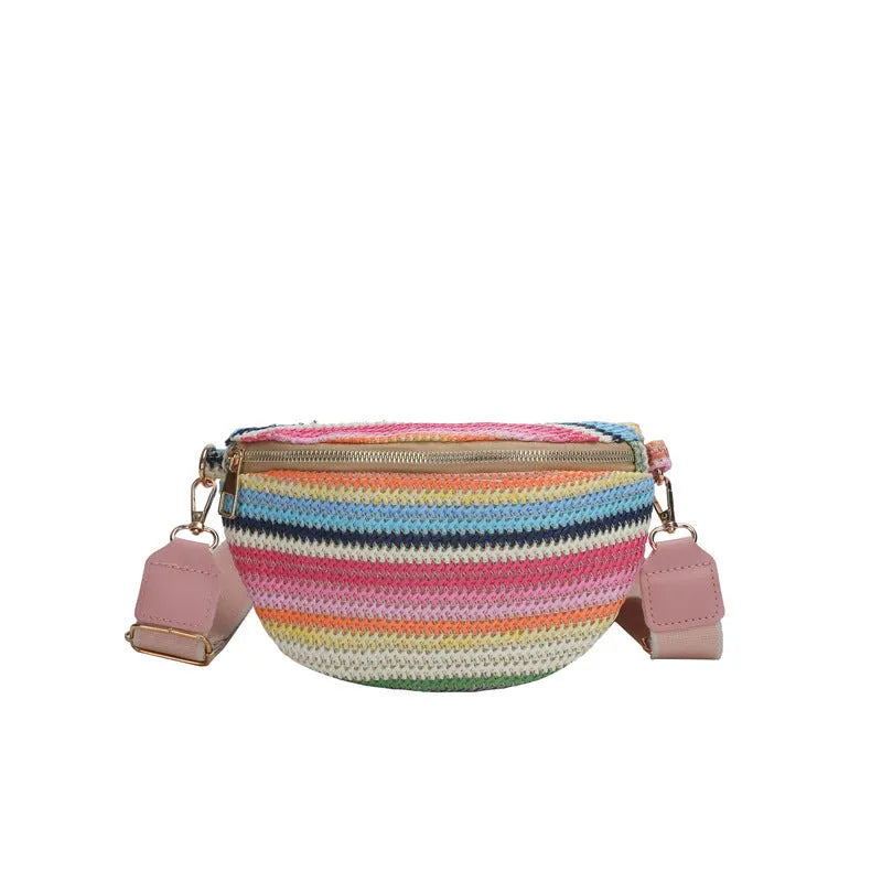 Bohemian style straw beach bag for women in shell shape with single strap and zipper closure available in pink or blue