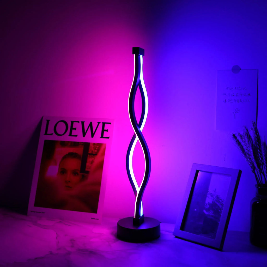 Black aluminium desk lamp with three-colour dimming button and touch-sensitive blue pink areas