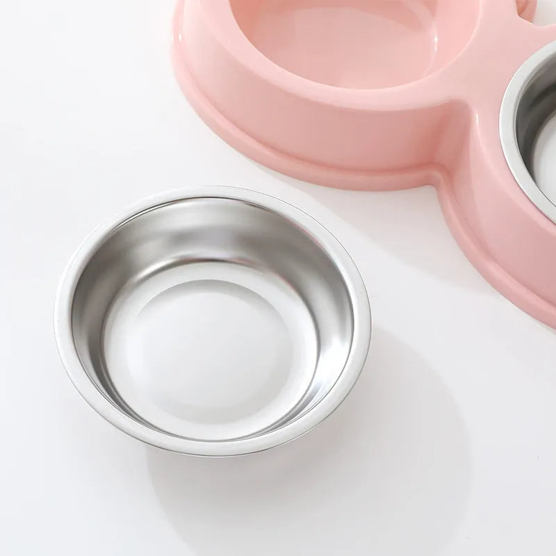 Stainless steel double pet bowl with frog-shaped non-slip base in blue, green, and pink colours