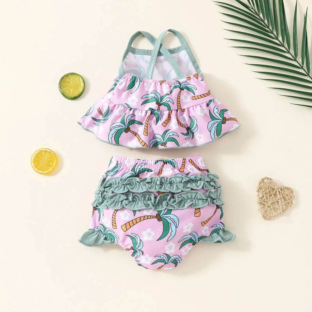 White baby swimsuit set with top and shorts on hanger