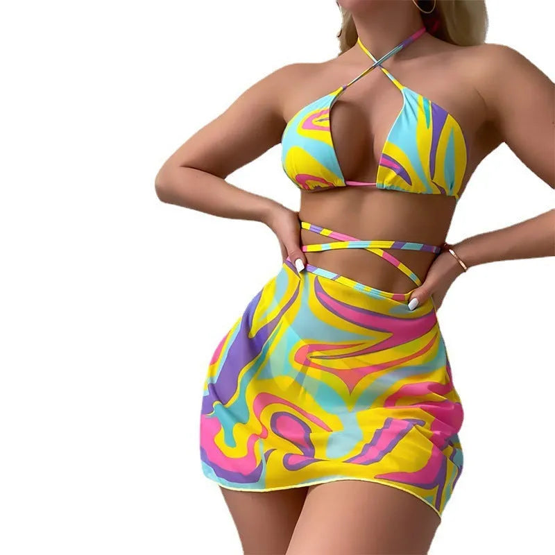 Yellow striped print halter neck swimsuit with lace-up front, includes skirt and shorts