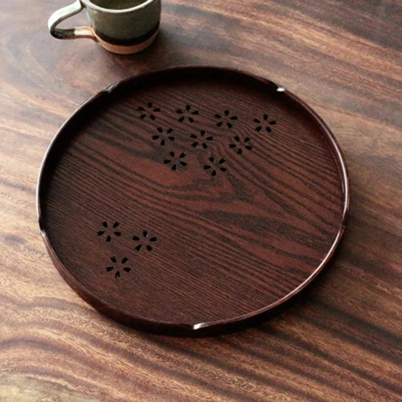 Wooden round plate with hollow cherry blossom pattern, 30 cm diameter.