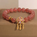 Women's strawberry quartz crystal bracelet with four leaf dream catcher ball pendant