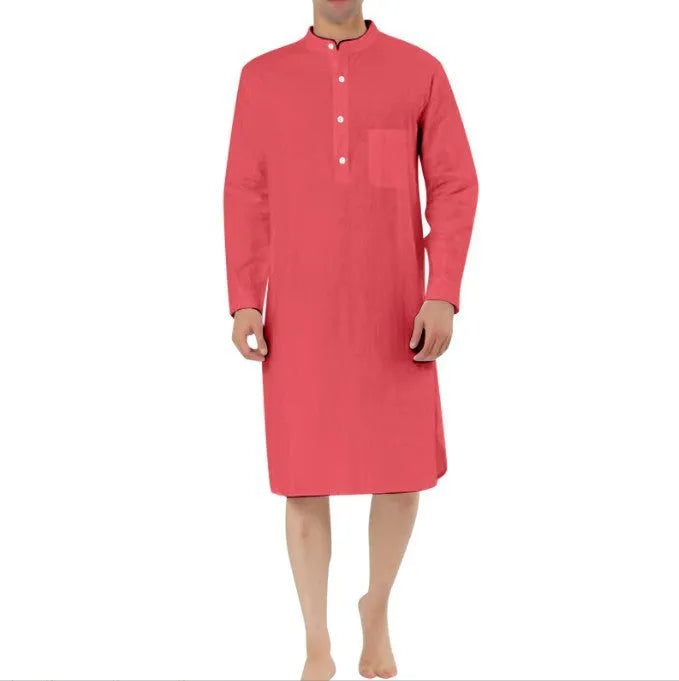 Man wearing a dark blue cotton shirt robe with button front and chest pockets.