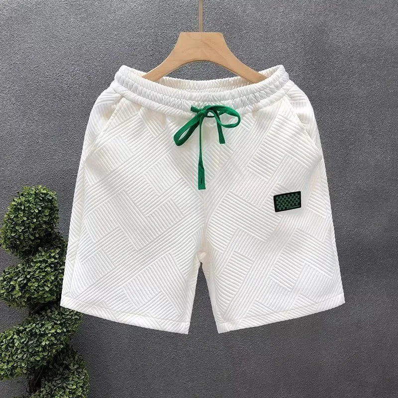 Men's white casual sports shorts with micro elasticity fabric on man at beach