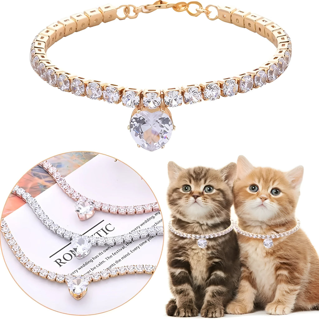 Gold rhinestone heart-shaped pet collar for dog or cat with bling design on a black background.