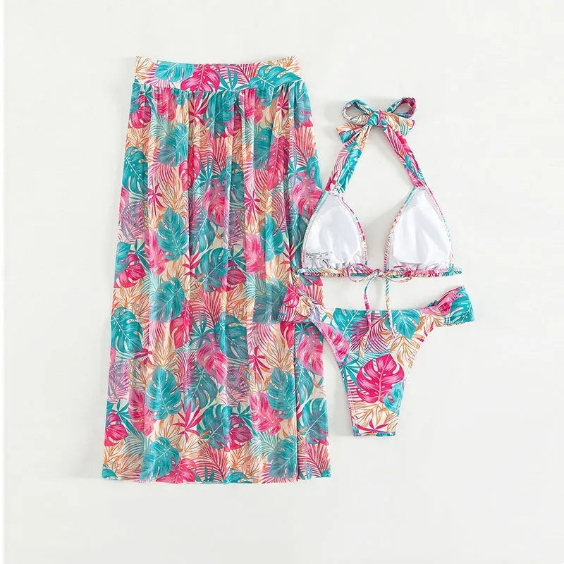 Women's three-piece swimsuit set with floral print, mesh beach skirt, and split design in picture colour.