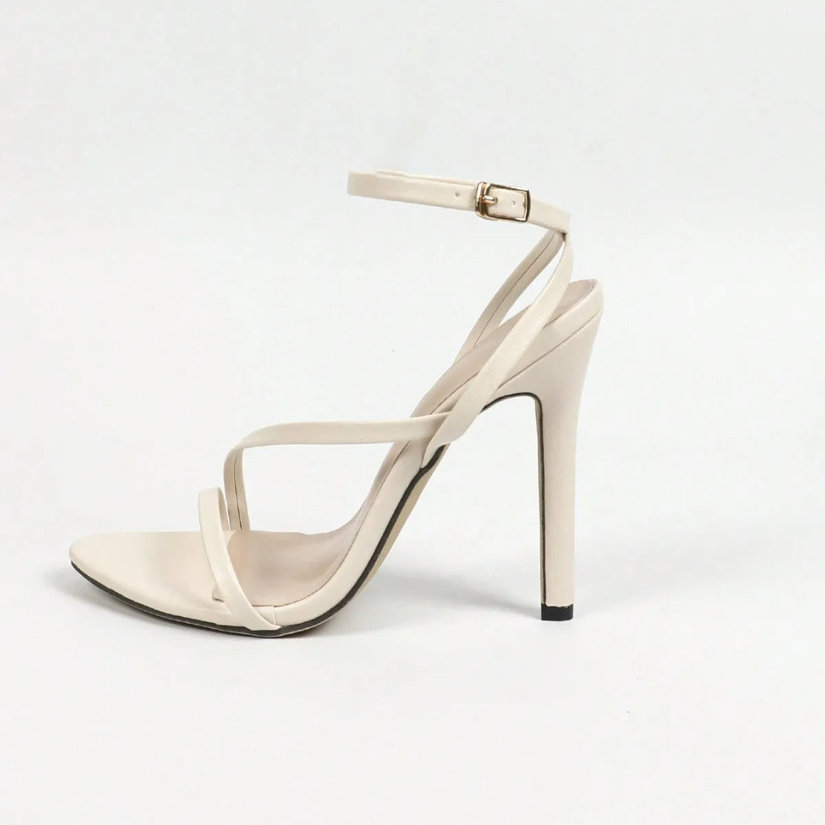 Women's gold open toe high heel sandals with a cross design ankle strap and rubber sole.