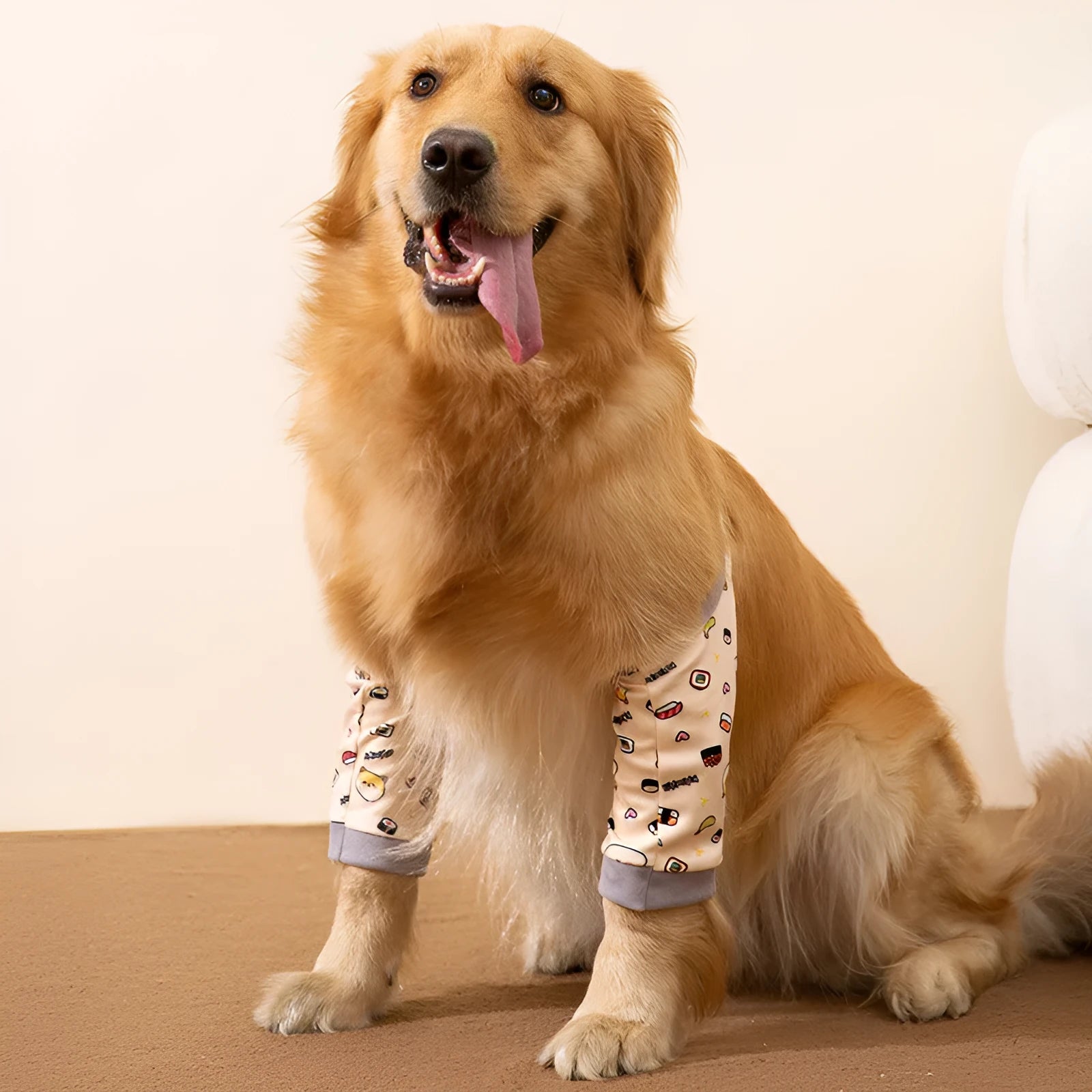 Blue dog knee protector sleeve with elbow padding and plastic buckle, shown with a matching patterned scarf.
