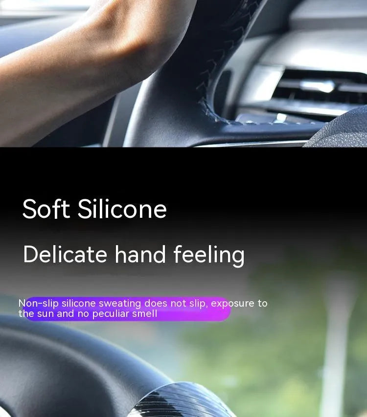Black and blue silicone steering wheel assist balls showing size against a car steering wheel.
