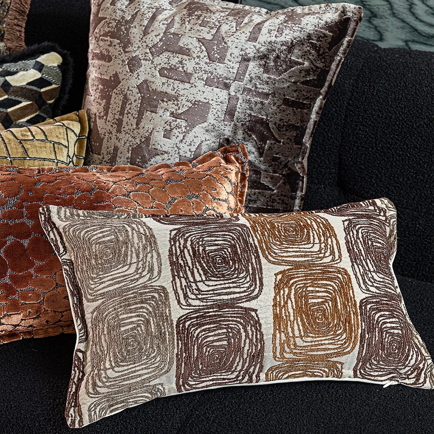 Square pillow cover with abstract coil pattern in cream and coffee colours