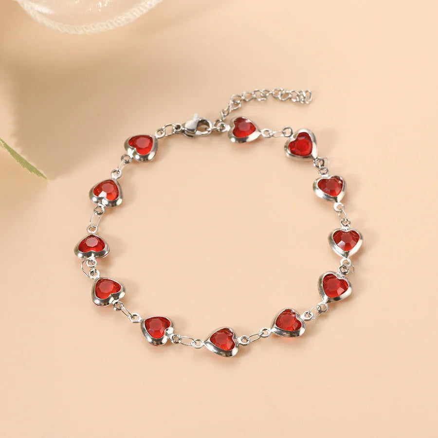 Devil's Eye geometric heart bracelet in stainless steel, shown in colourful, blue, green, or red electroplated finish
