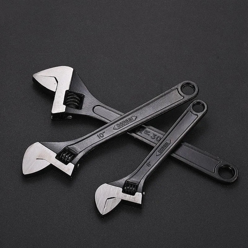 Stainless steel adjustable wrench with blackened finish showing adjustable jaw mechanism