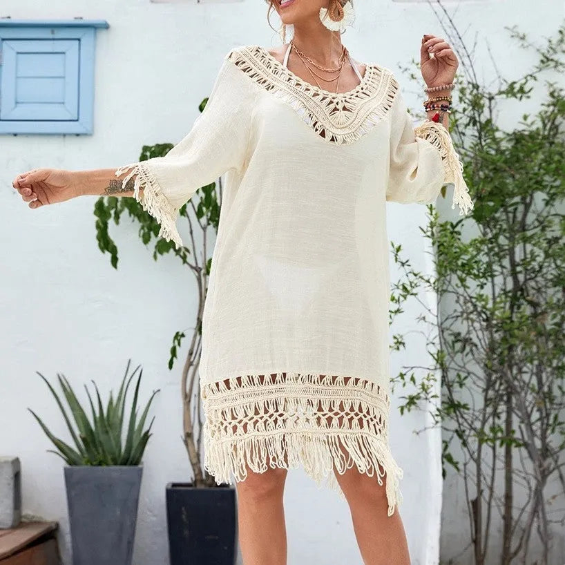 Apricot crocheted patchwork dress with mid-length skirt and half sleeves on hanger