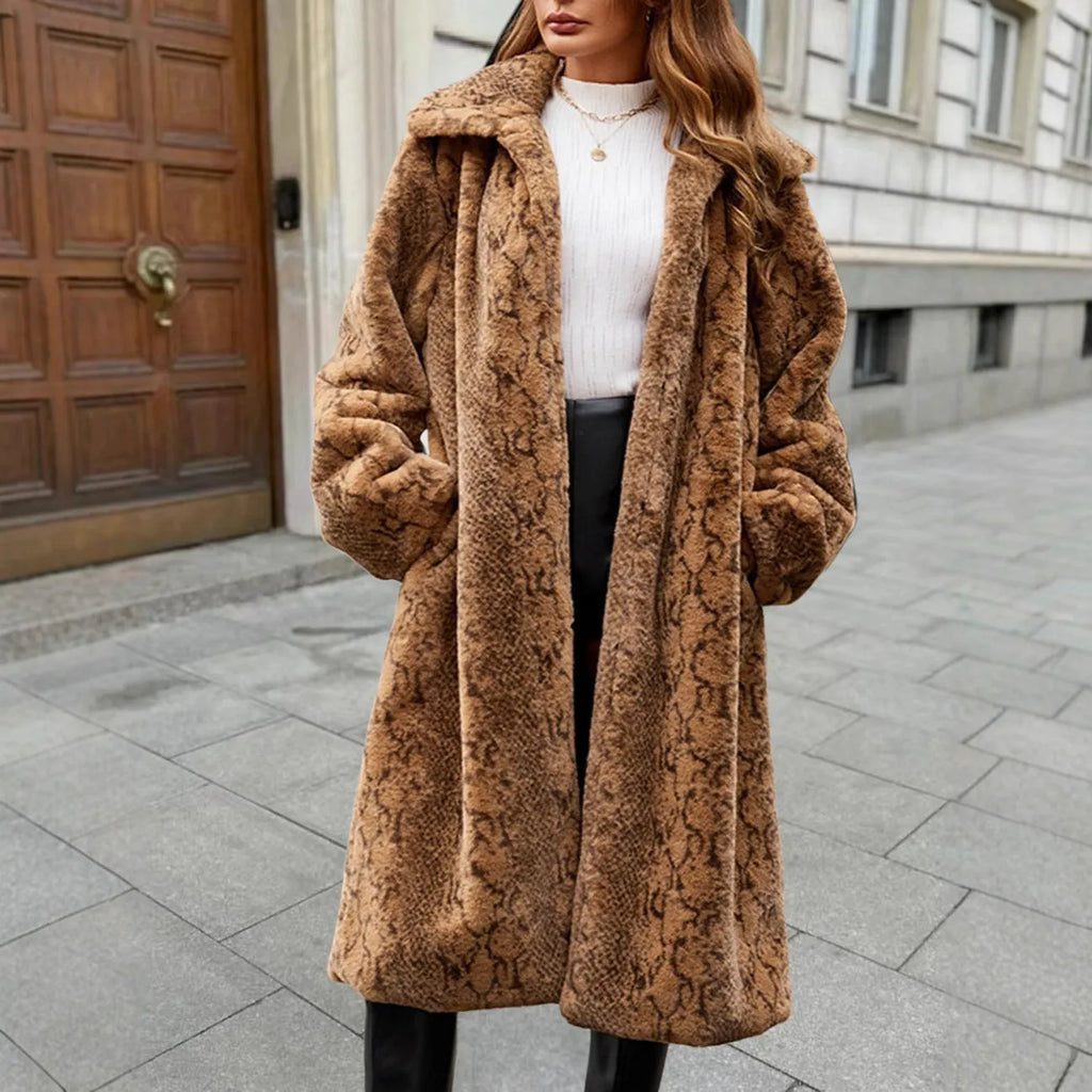 Women's longline faux fur coat in leopard print with regular sleeves and an over-the-knee length.