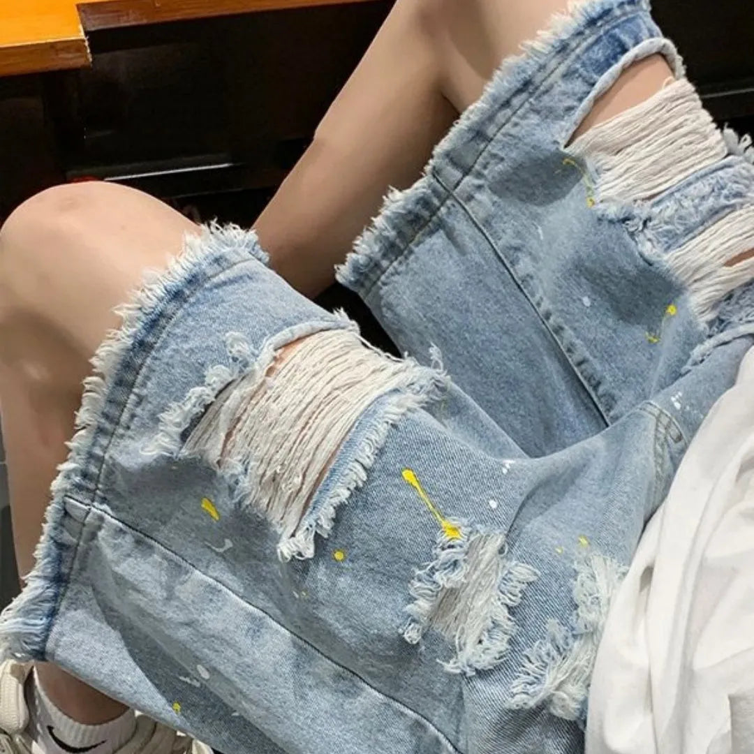 Men's casual denim shorts with water washed distressing and loose street style fit