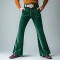 Man wearing gold velvet slim flared suit trousers in dark red for a formal banquet setting.