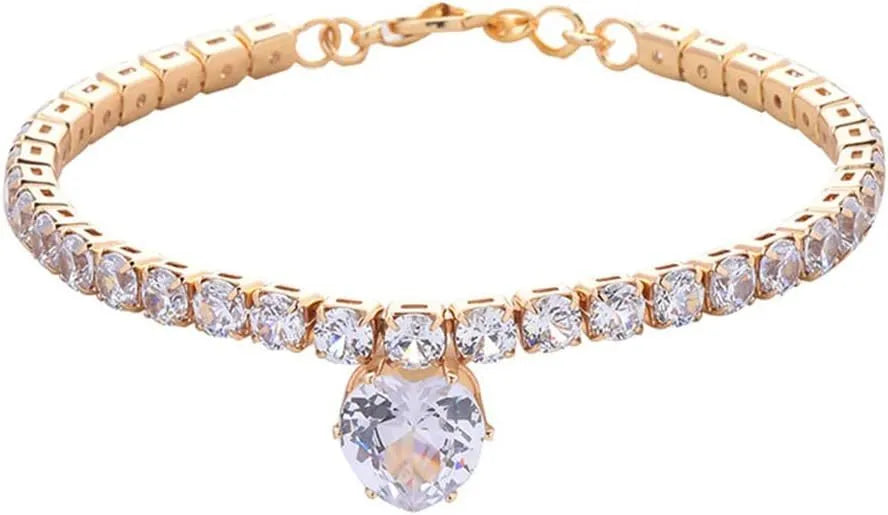 Gold rhinestone heart-shaped pet collar for dog or cat with bling design on a black background.