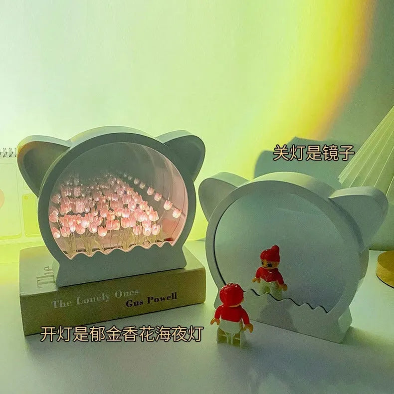 Handmade DIY cat head silhouette night lamp surrounded by tulip flowers, shown in pink colour option.