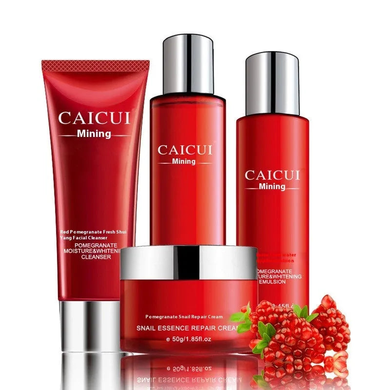 Pomegranate skincare set with four products: face wash, toner, lotion and facial cream in red packaging.