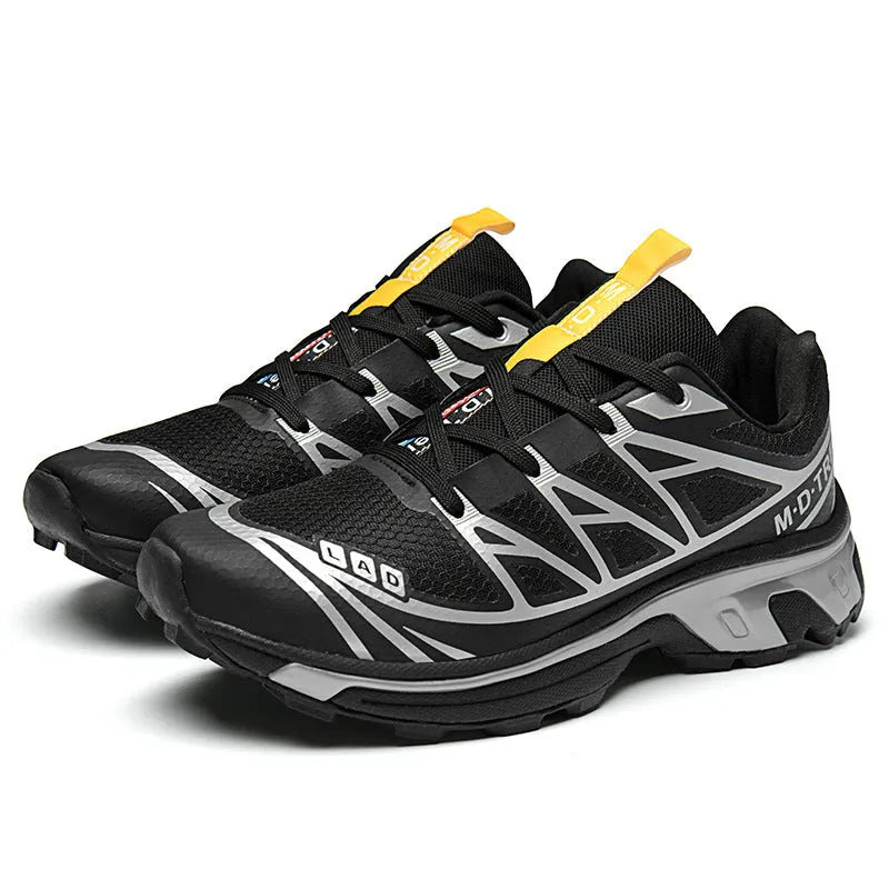 Men's and women's low-top black and grey hiking shoes with rubber sole and lace-up front.
